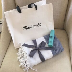 Madewell Navy and White Beach towel and NEW sun bum hydrating serum